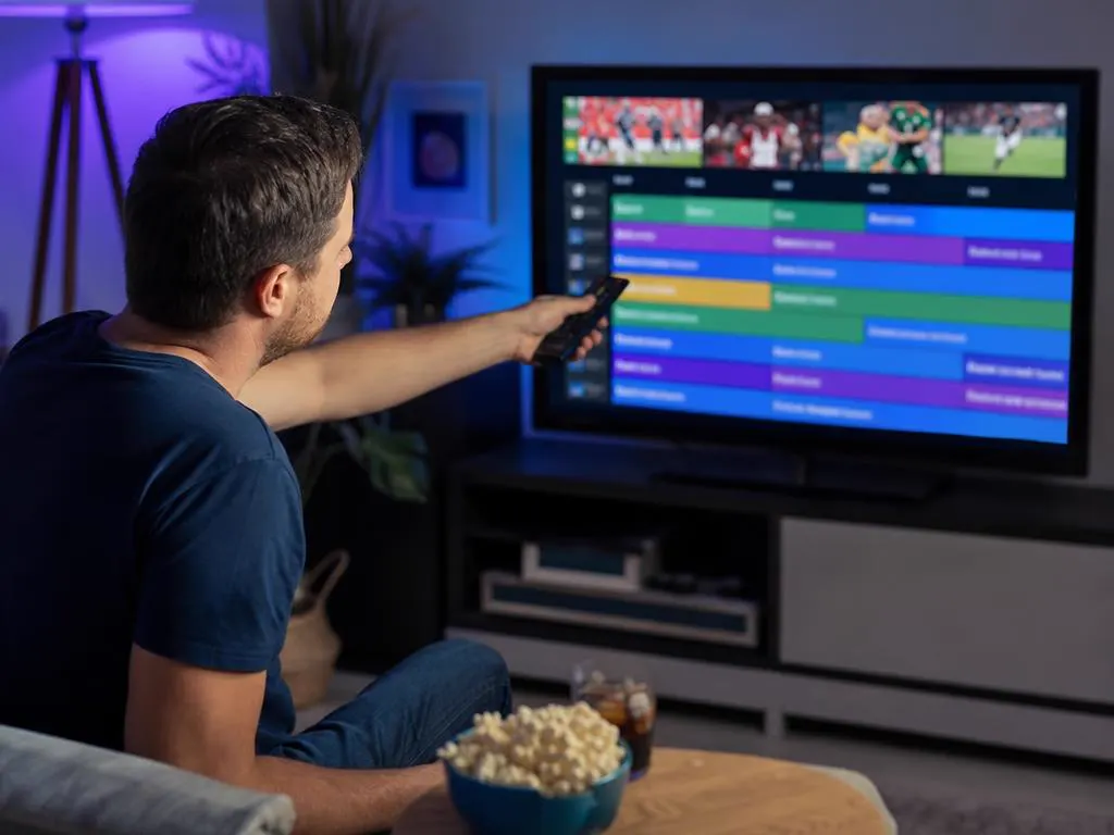Fan finding the next game in a TV guide