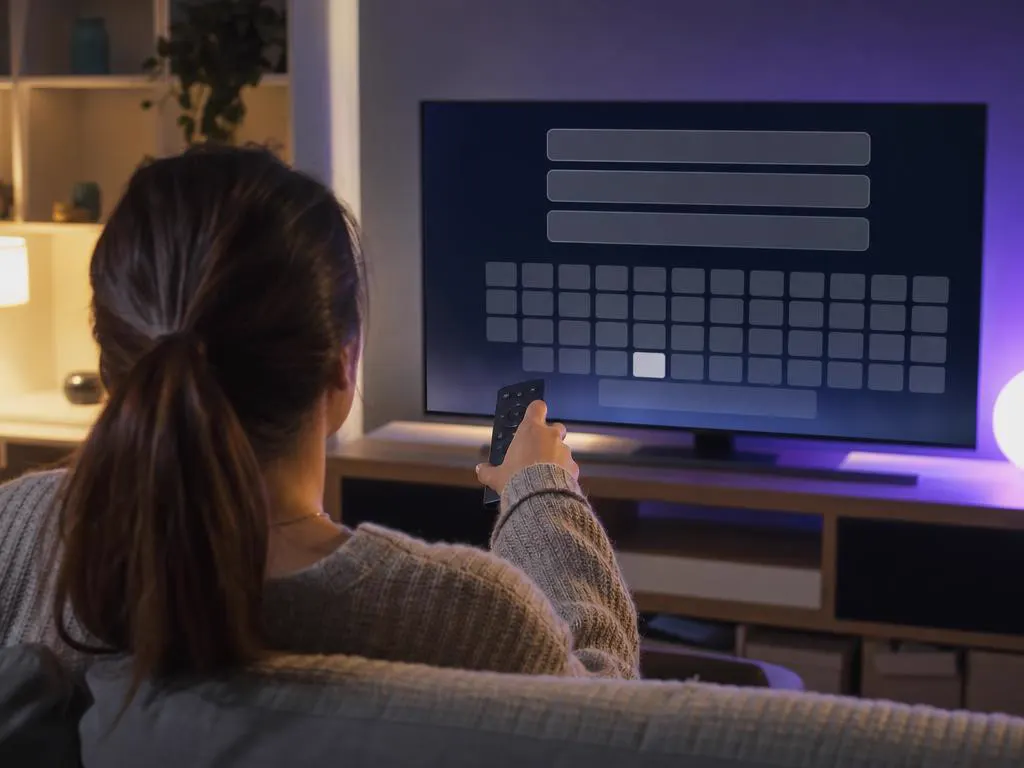 Entering login details on a TV with an on-screen keyboard